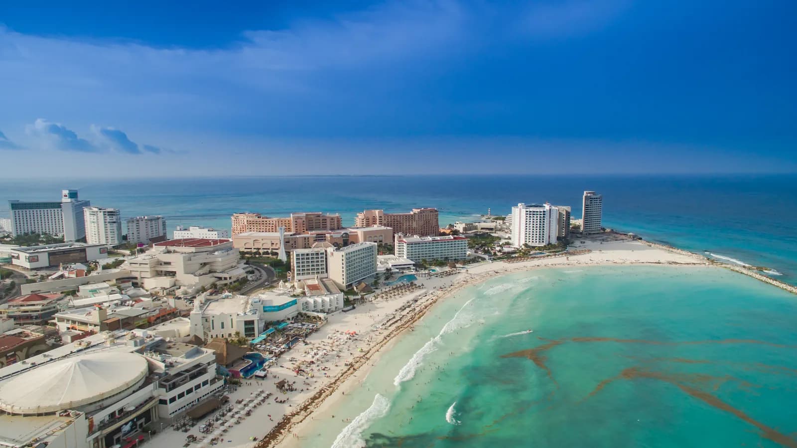 Aerial view of the Cancún Hotel Zone, its resort strip and white beach beside the turquoise Caribbean