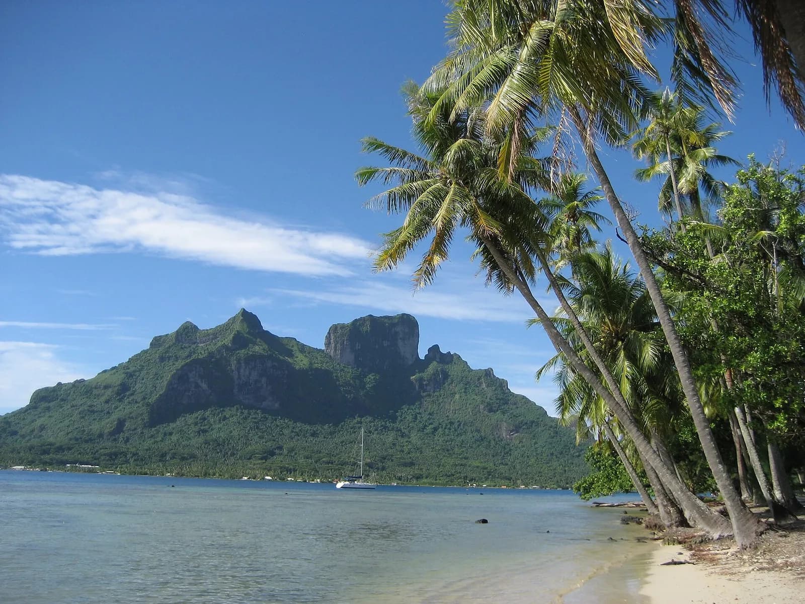Matira Beach, Bora Bora, French Polynesia - palm-lined shore with Mount Otemanu rising across the lagoon