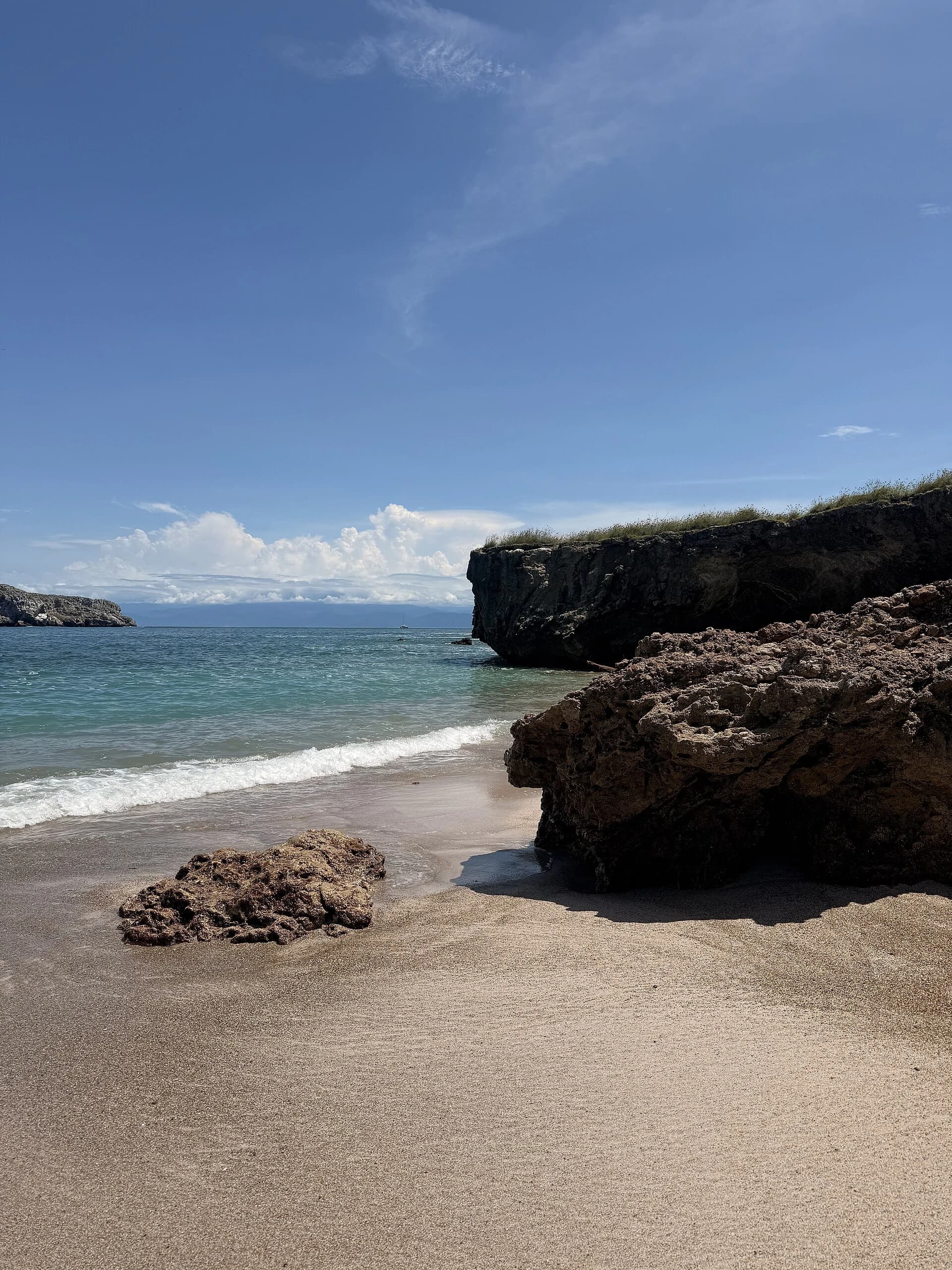 Playa del Amor (Hidden Beach), Marieta Islands, Mexico — soft sand, turquoise shallows and weathered cliffs seen from the beach