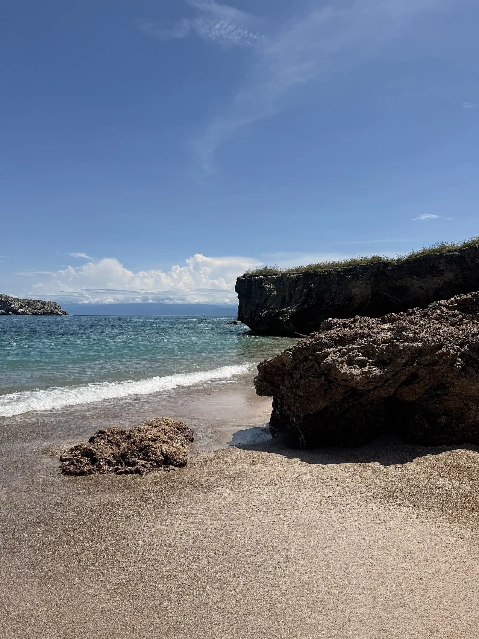 Playa del Amor (Hidden Beach), Marieta Islands, Mexico - soft sand, turquoise shallows and weathered cliffs seen from the beach