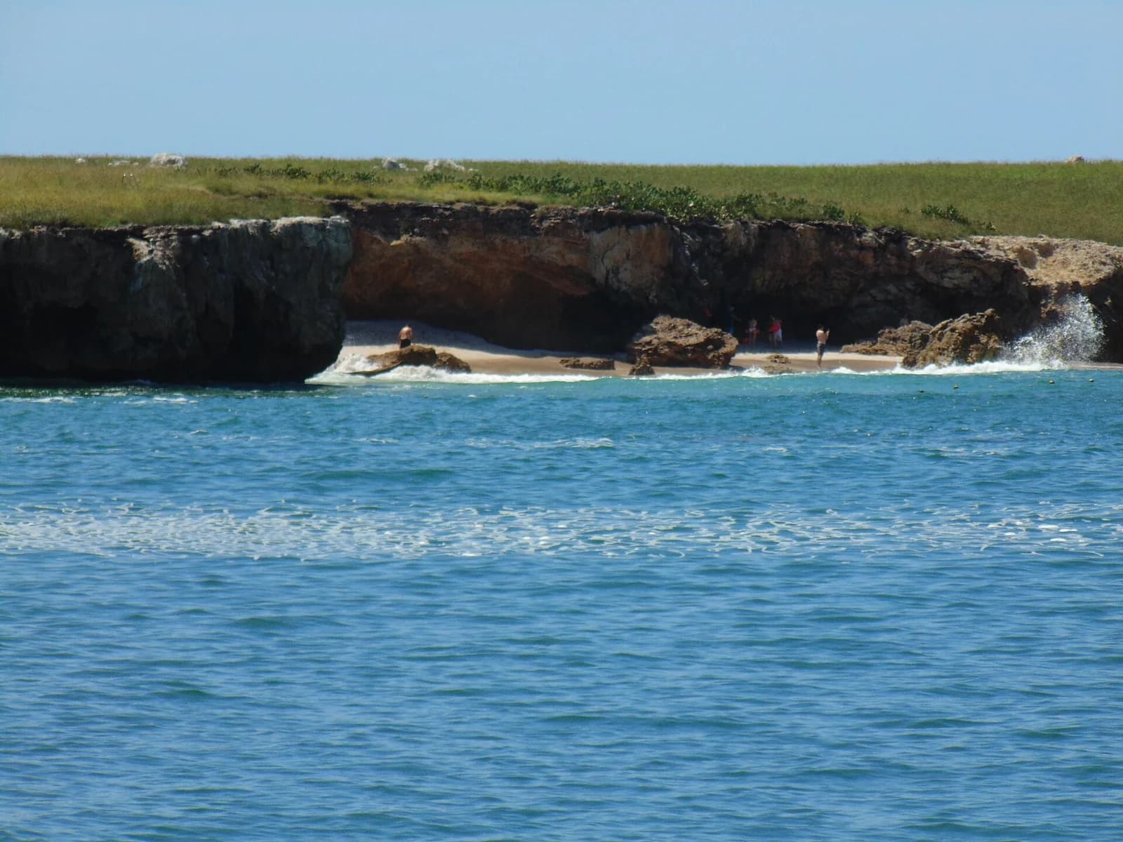 Playa del Amor (Hidden Beach), Marieta Islands, Mexico - the sandy cove tucked beneath the island's rocky cliffs, seen from the water