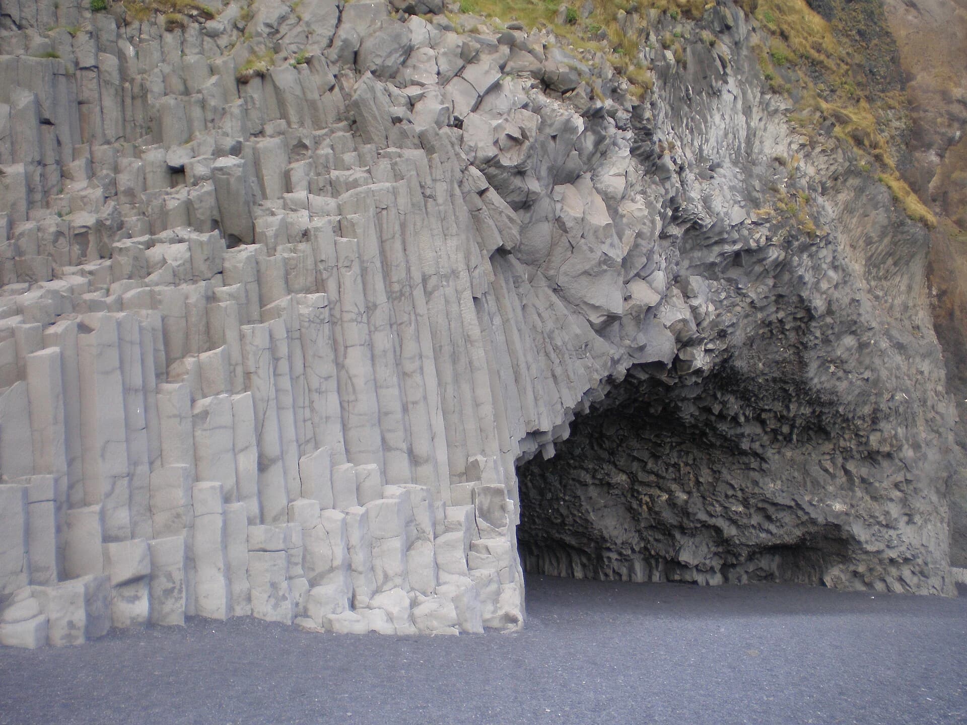 Reynisfjara, South Iceland — stacked basalt columns and cave above the black sand