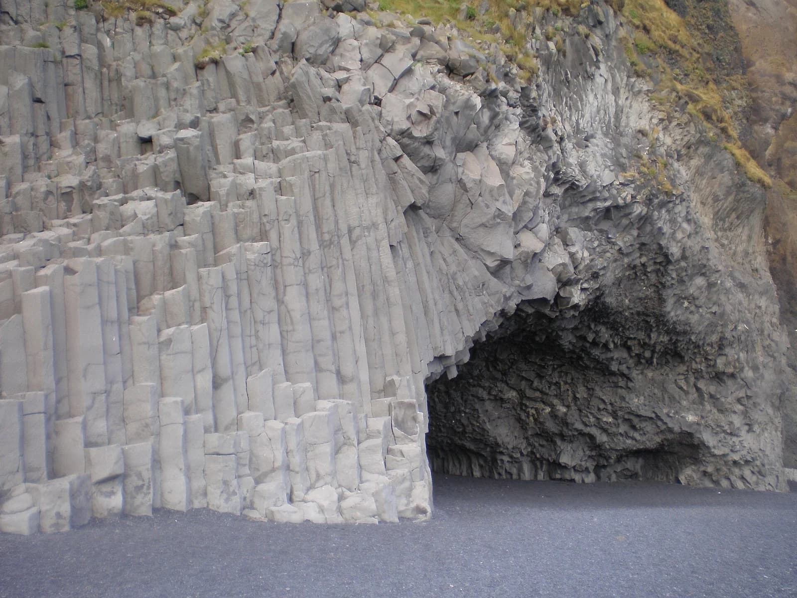 Reynisfjara, South Iceland - stacked basalt columns and cave above the black sand
