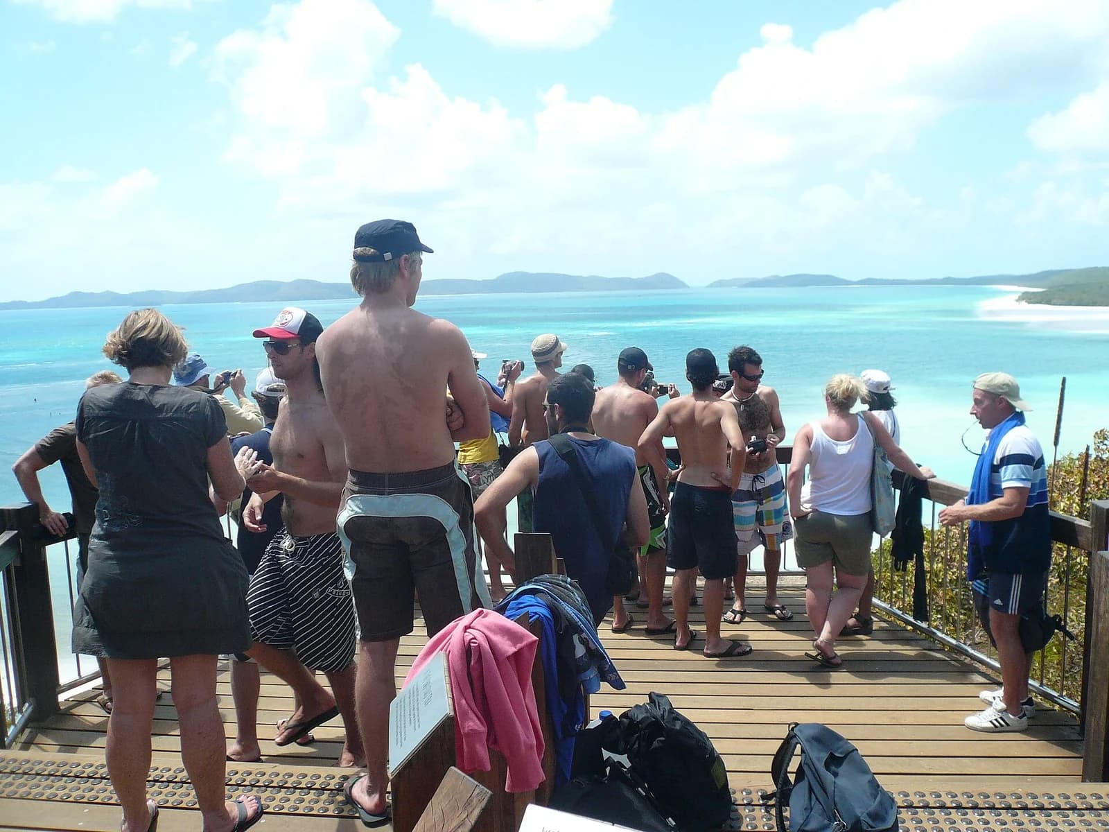 Whitehaven Beach, Whitsunday Islands, Australia - visitors walking the white sand shoreline