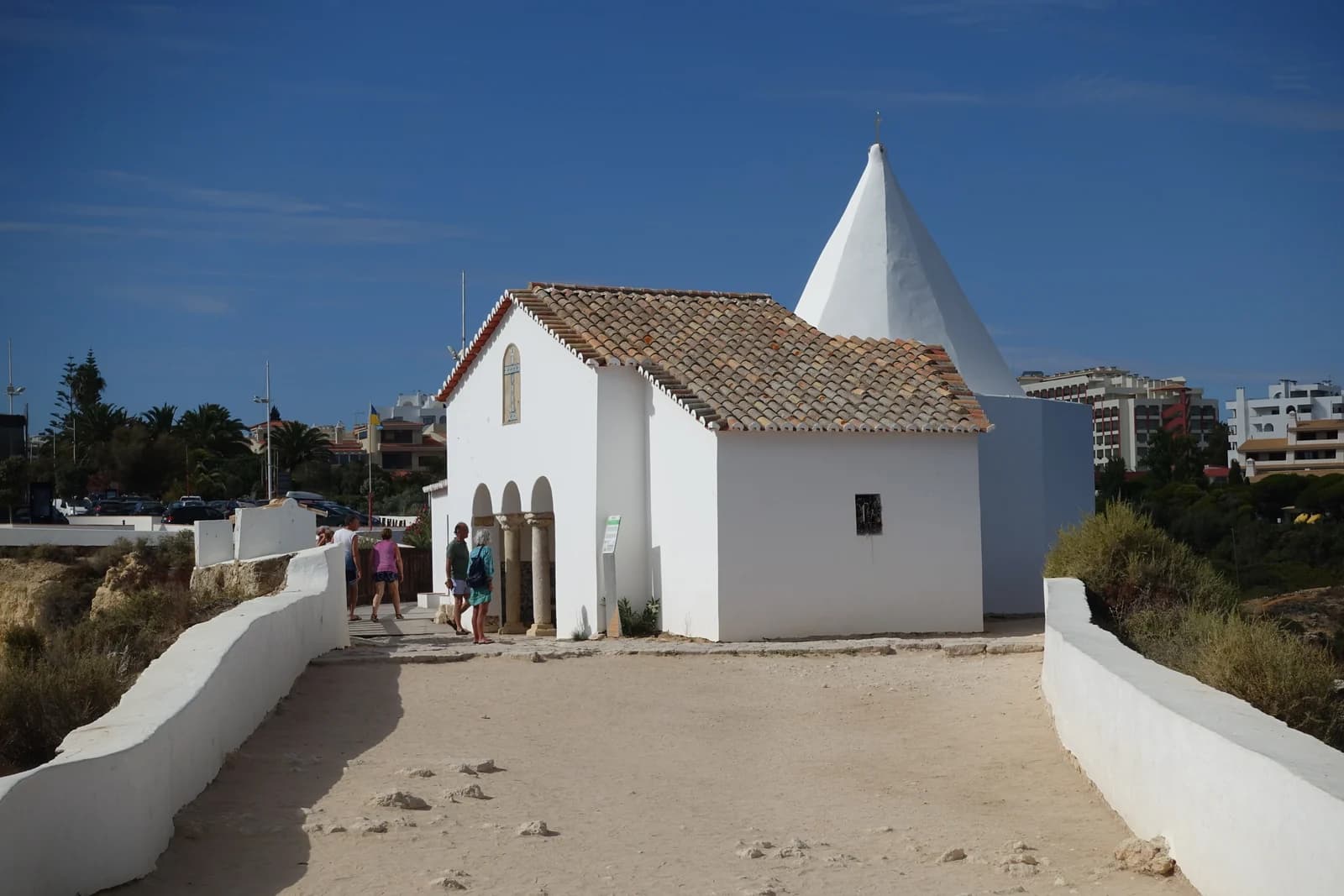 The white chapel of Nossa Senhora da Rocha on the clifftop near Porches, on the stretch of Algarve coast where the luxury resorts sit