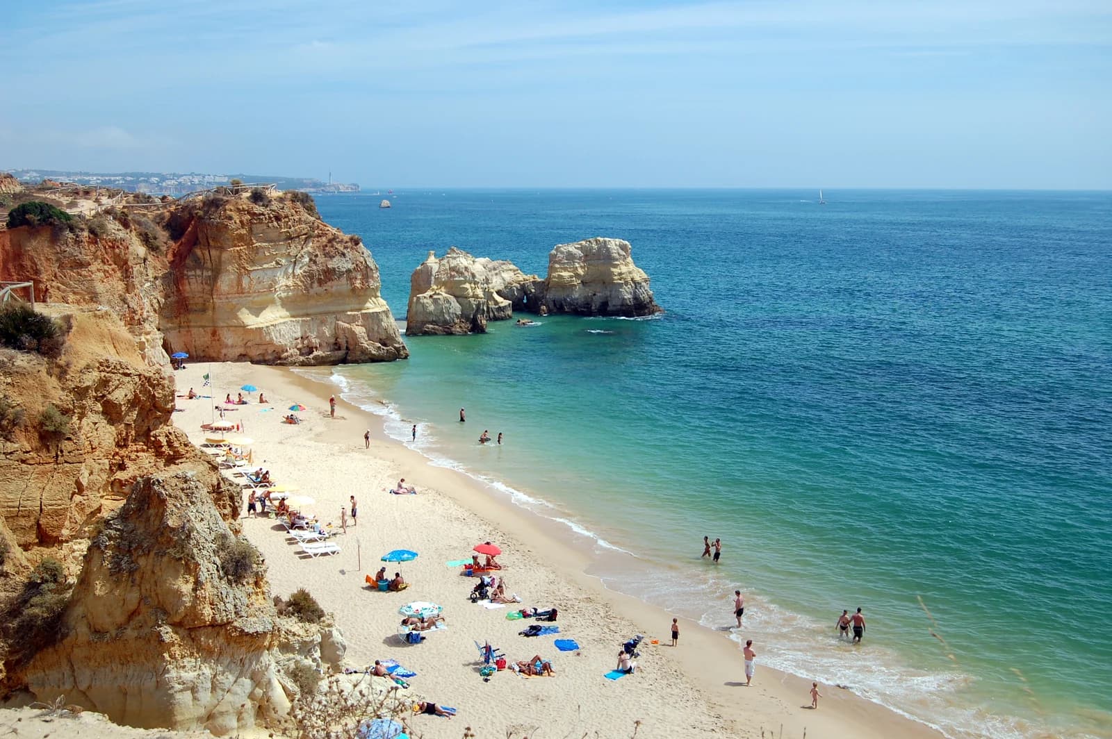 Golden cliffs and sea stacks above the sand of Praia da Rocha in Portimão