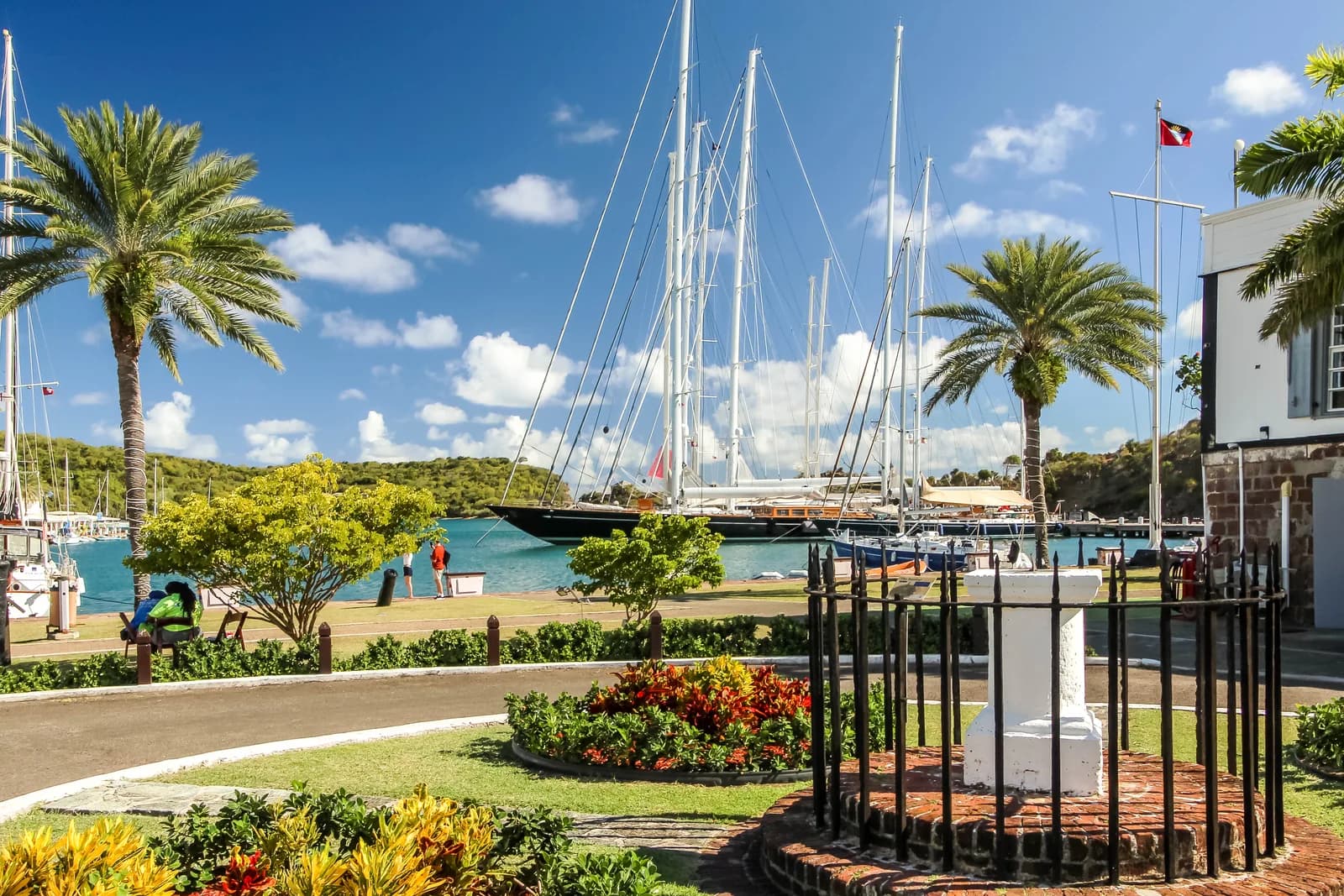 Yachts moored at Nelson's Dockyard in English Harbour, seen across the dockyard lawns
