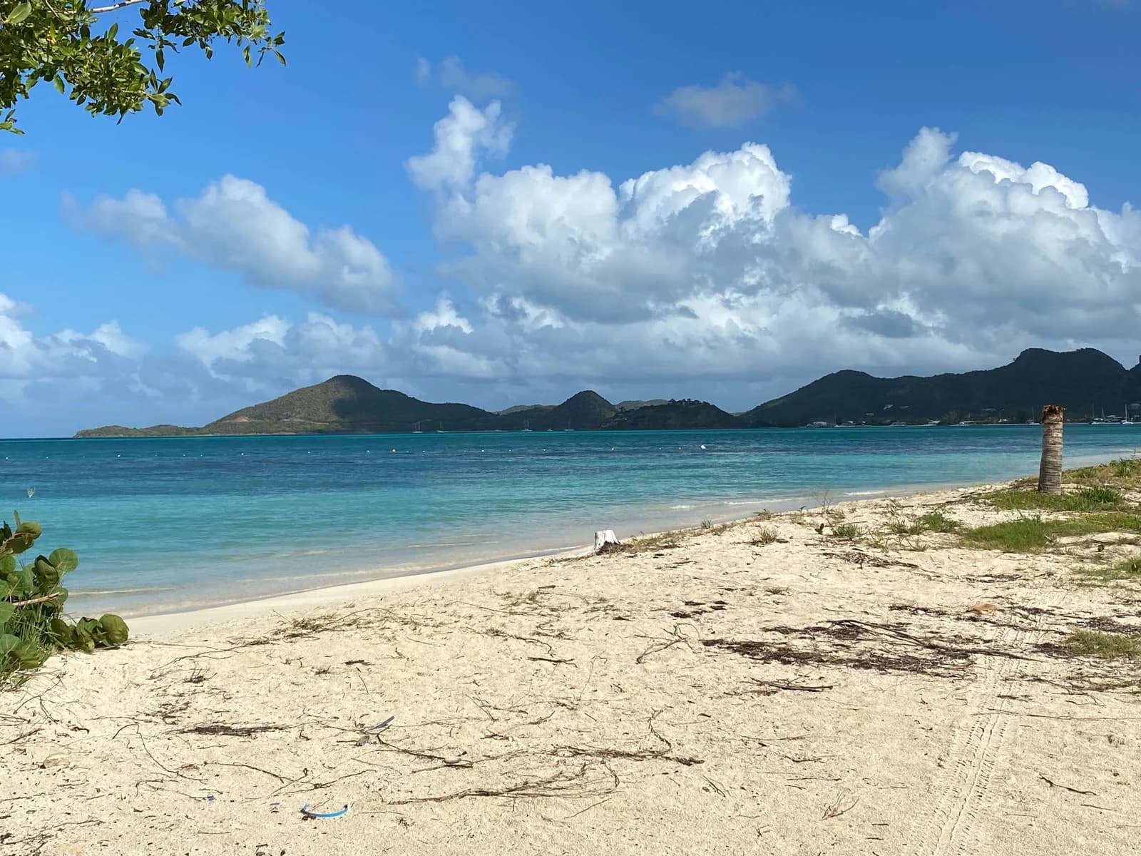 Little Ffryes Beach on Antigua's south-west coast, with the island's hills behind