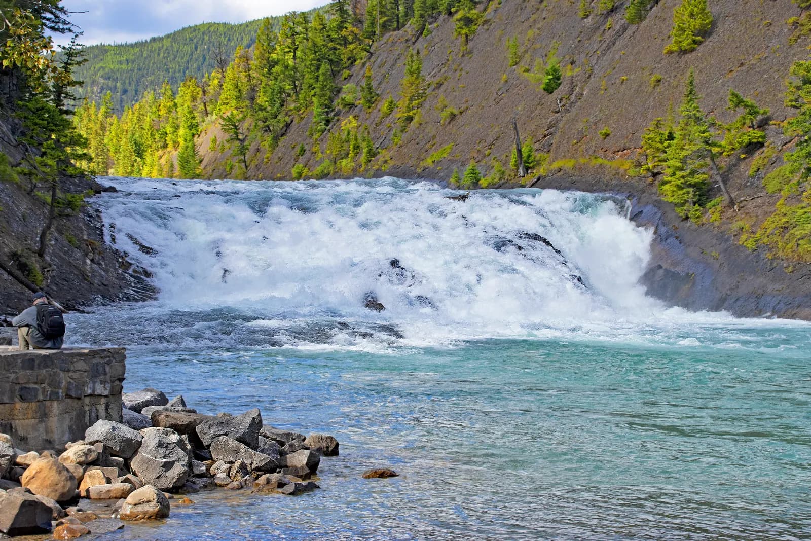 The wide shallow drop of Bow Falls on the edge of Banff townsite, a walk from the lower end of Banff Avenue