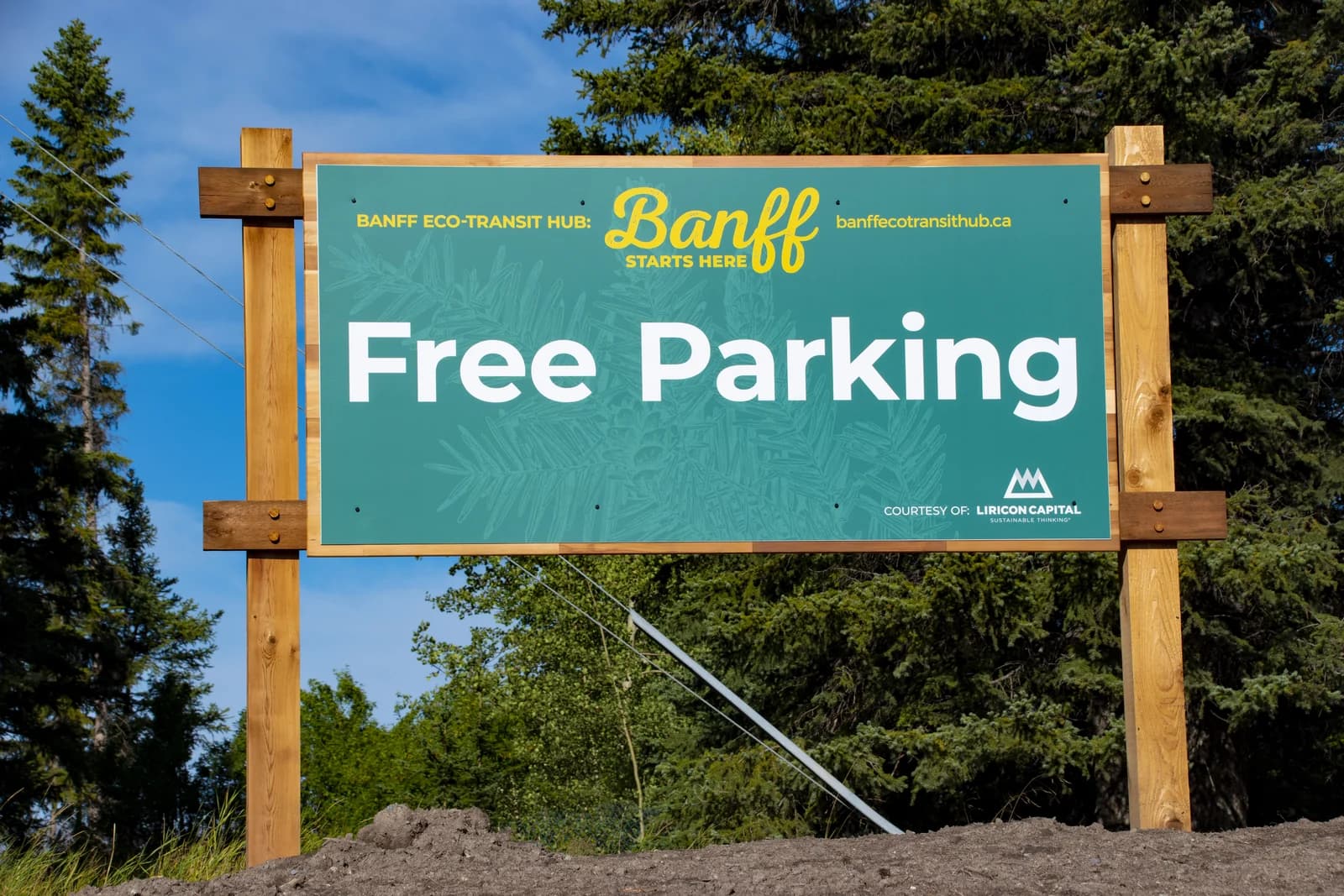The free parking sign at the Banff Eco-Transit Hub beside the old railway station, nine minutes' walk from the shops
