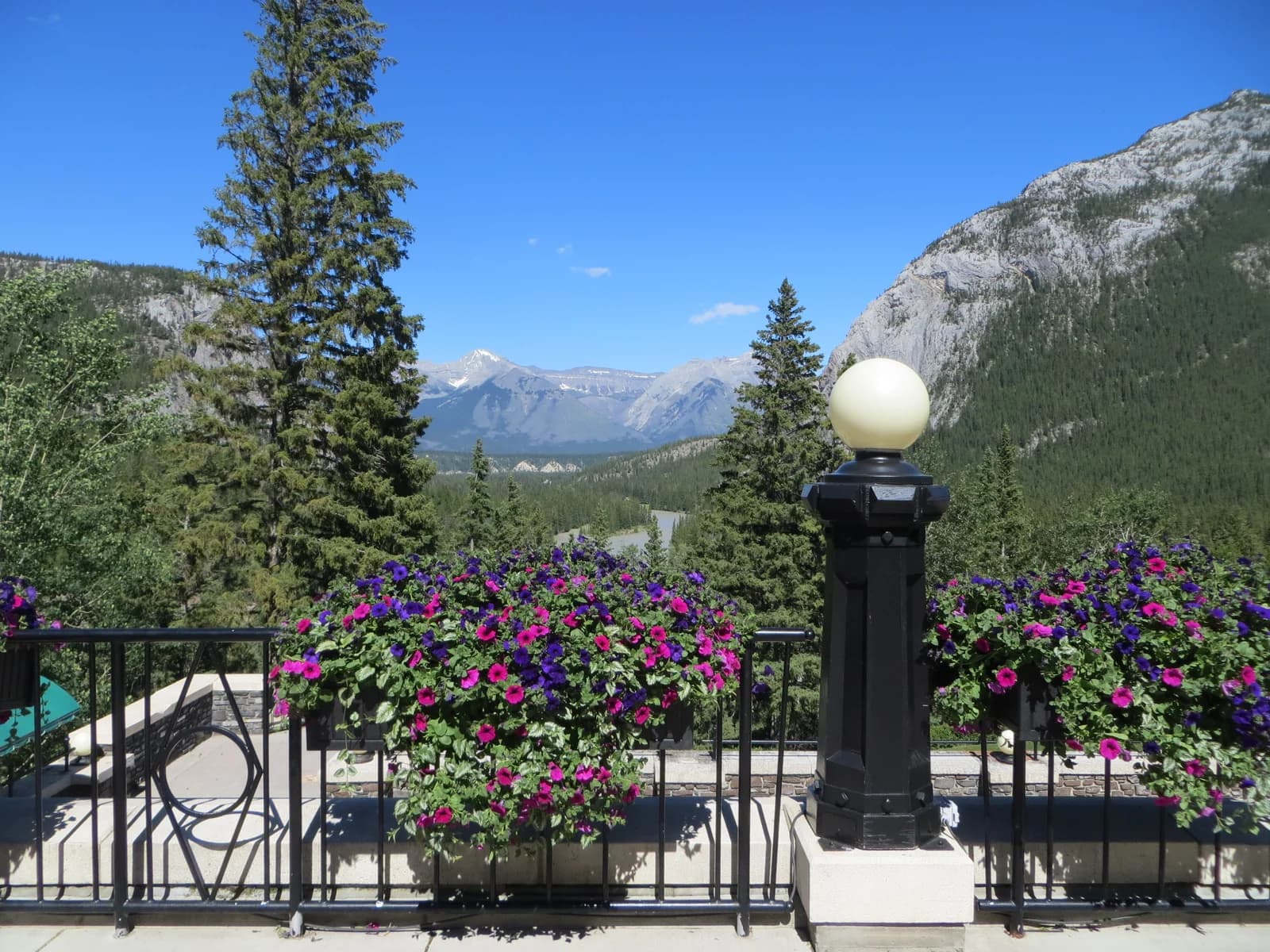The turreted stone bulk of the Banff Springs hotel standing above the trees of the Bow valley