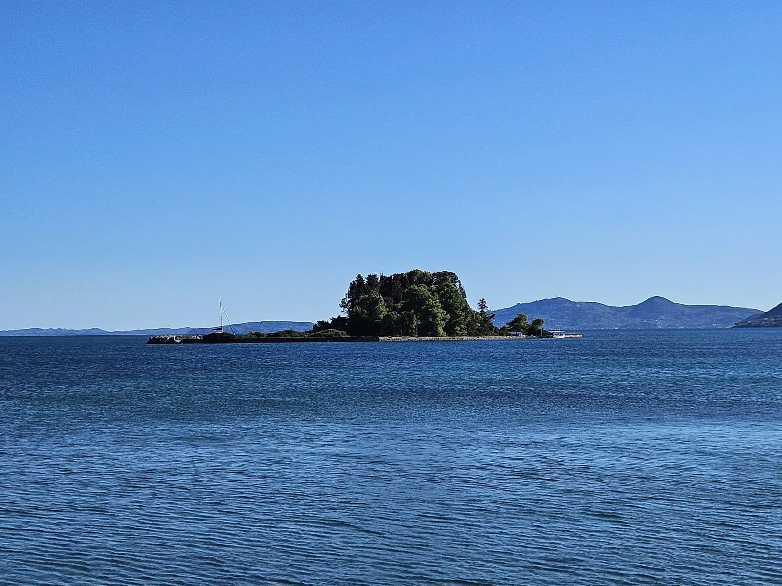 Pontikonisi, the wooded Mouse Island off Kanoni and Perama on Corfu's east coast