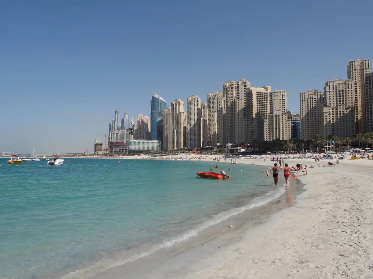 The beach at Jumeirah Beach Residence, backed by the towers of the Dubai Marina district