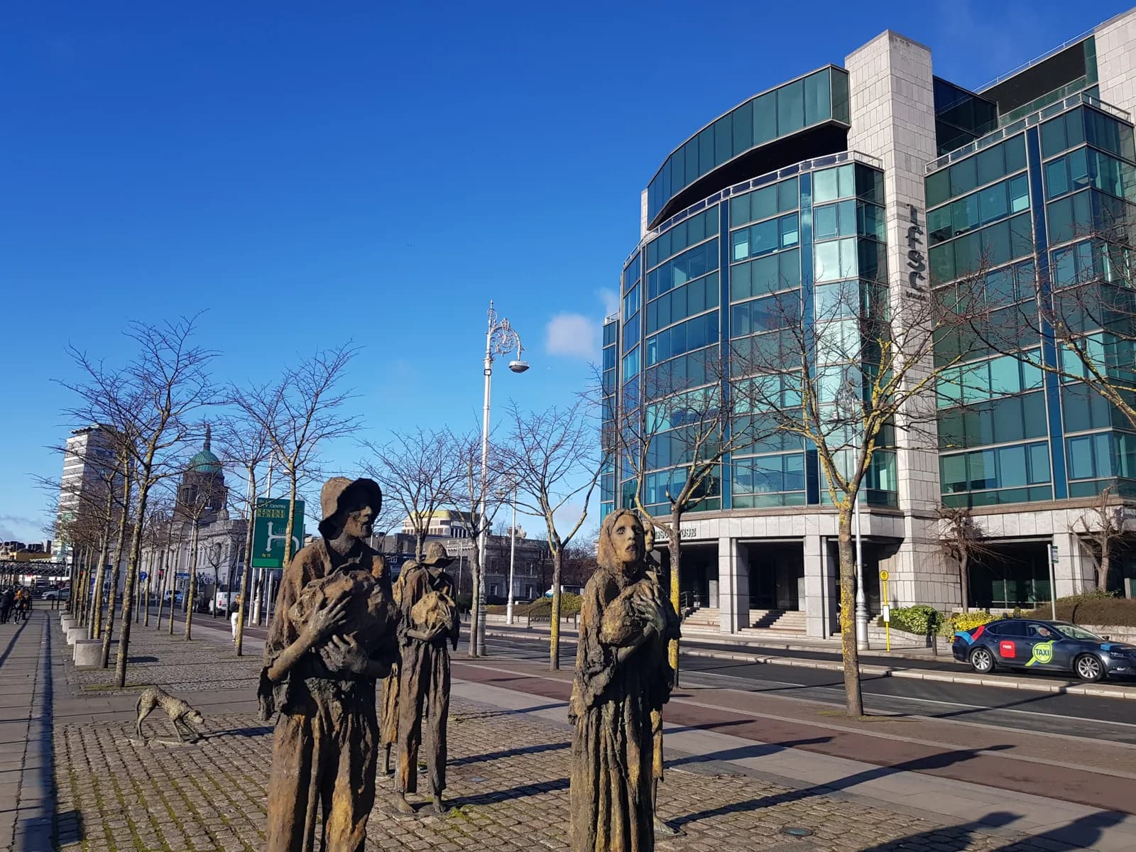 The Famine memorial and IFSC glass buildings on Custom House Quay