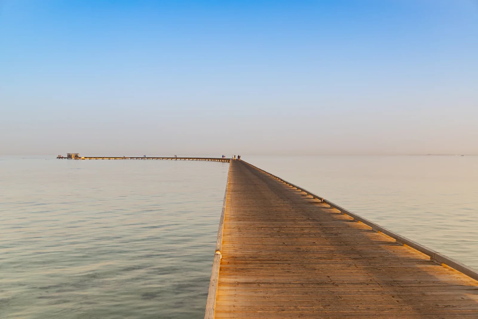 A long jetty running out over the shallows at Soma Bay, the way many Red Sea resorts reach swimmable water
