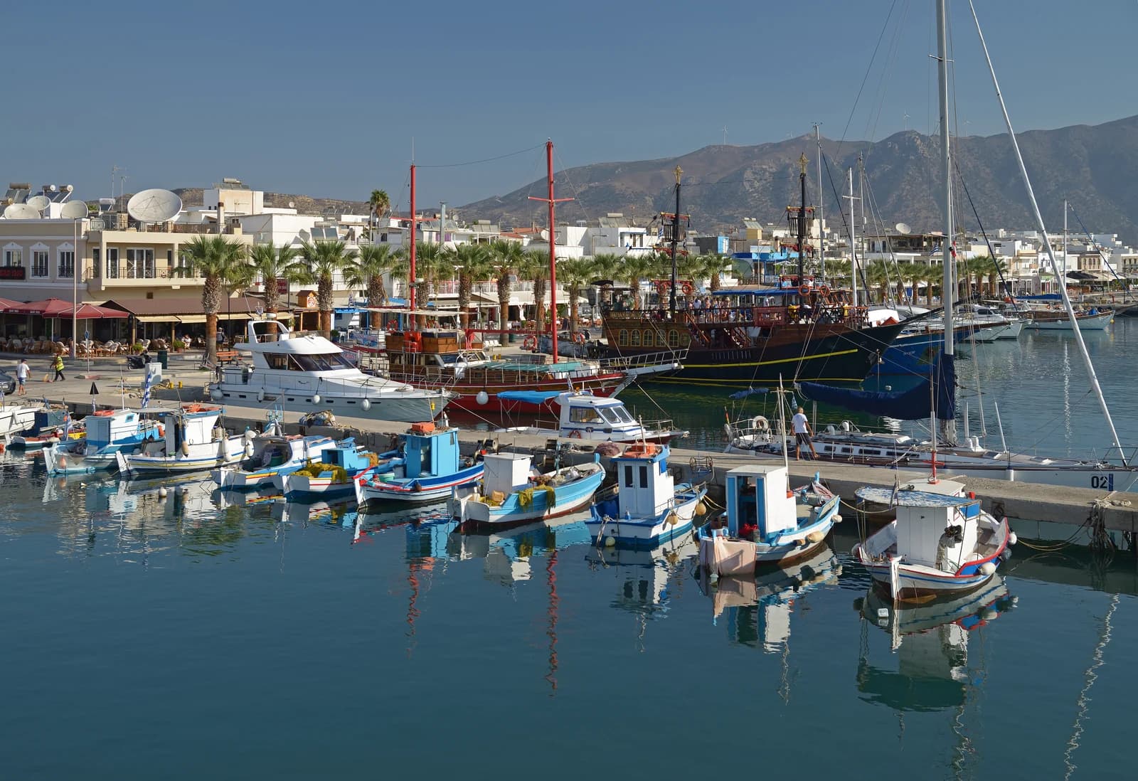 Fishing boats and excursion ships in Kardamena harbour on the south coast of Kos