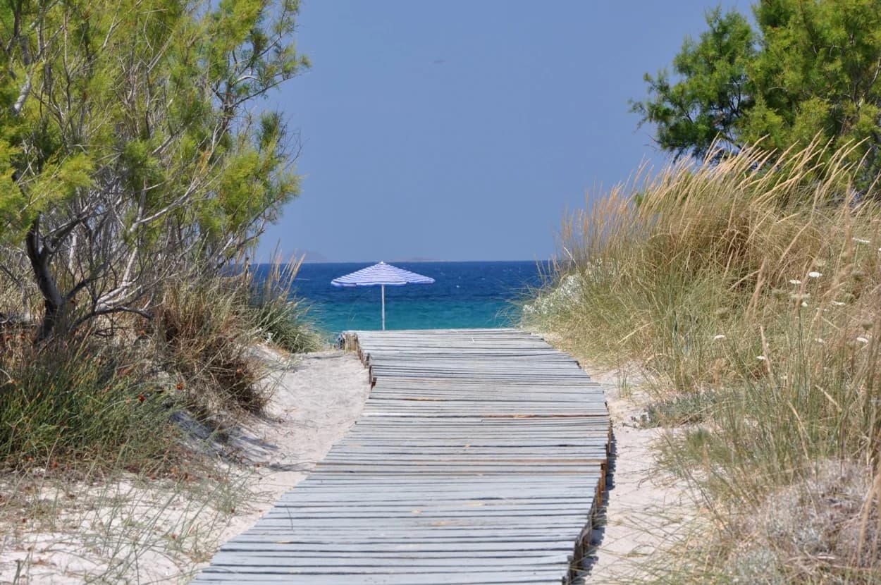 A wooden boardwalk through the dunes to the sea at Lambi, the beach just north of Kos Town