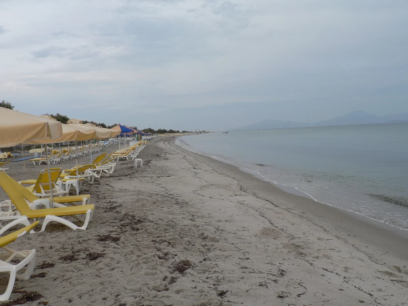 The long sandy beach at Tigaki on the north coast of Kos, lined with sunbeds