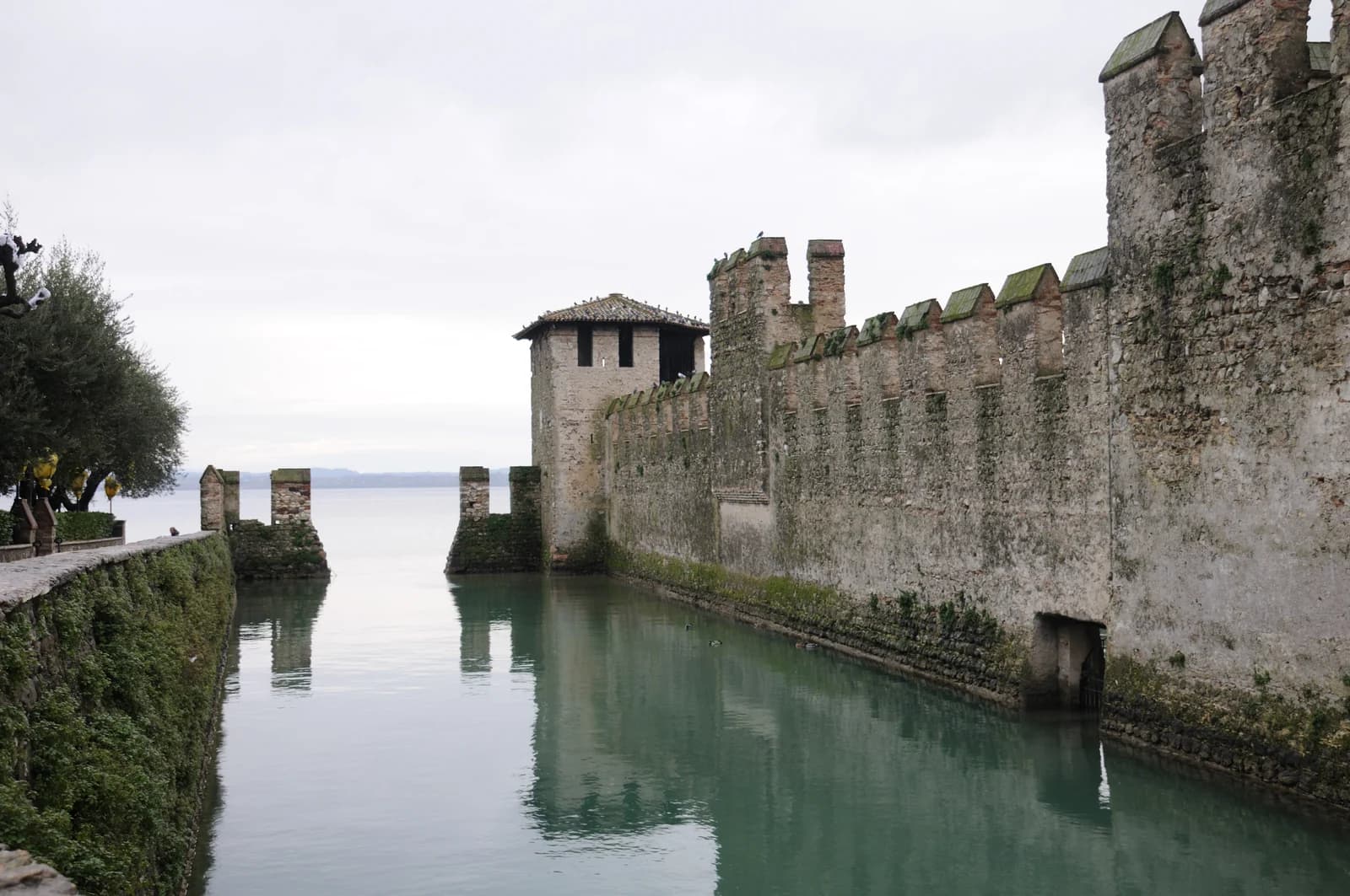The walled harbour of the Scaligero castle in Sirmione, on the square where the old town's castle-end hotels stand