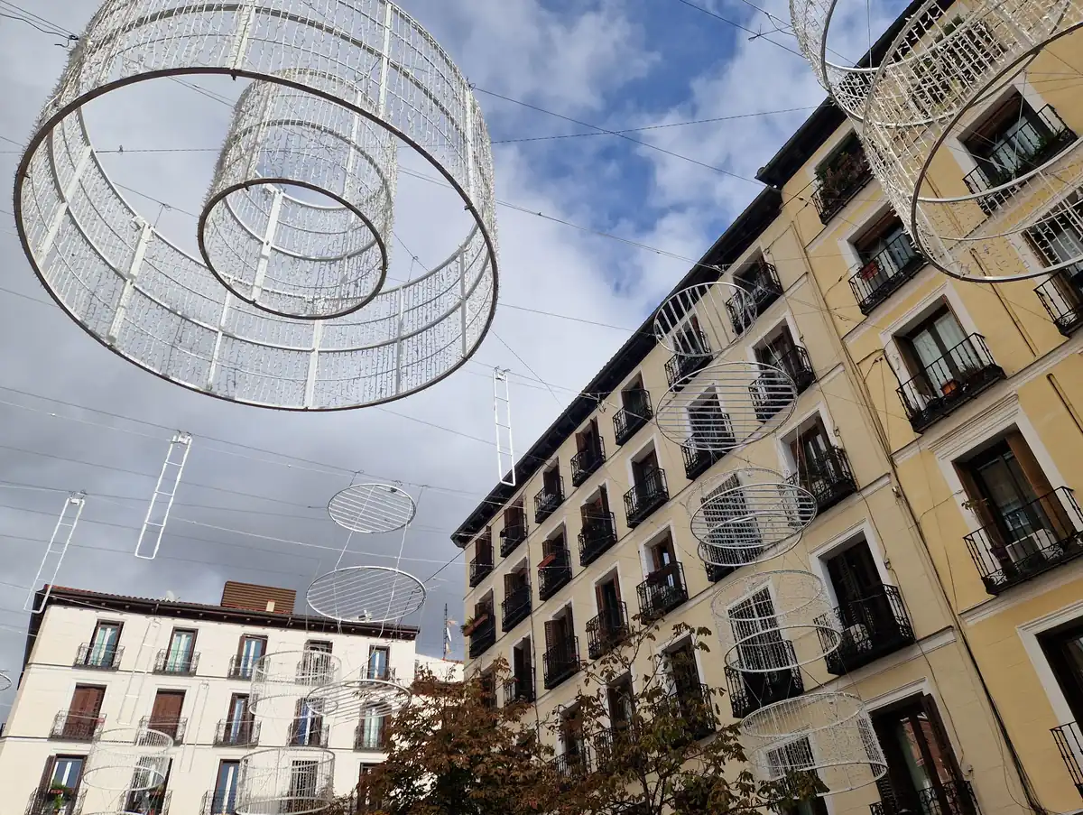 Festive lights strung over a street in Chueca, central Madrid