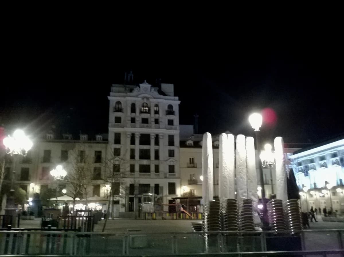 Plaza de Santa Ana in Madrid lit at night, the square the tapas quarter turns around