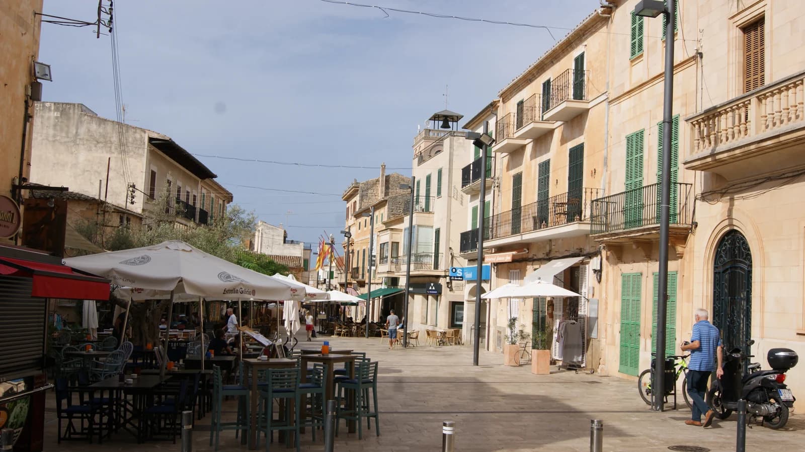 Cafe tables on a sandstone street by Plaça Major in Santanyí, the south-east town with one of the boutique hotels in Majorca