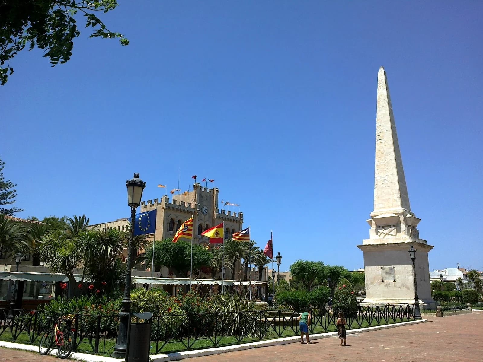 The obelisk and town hall on Placa des Born in Ciutadella, the square the Ciutadella walking times are measured to