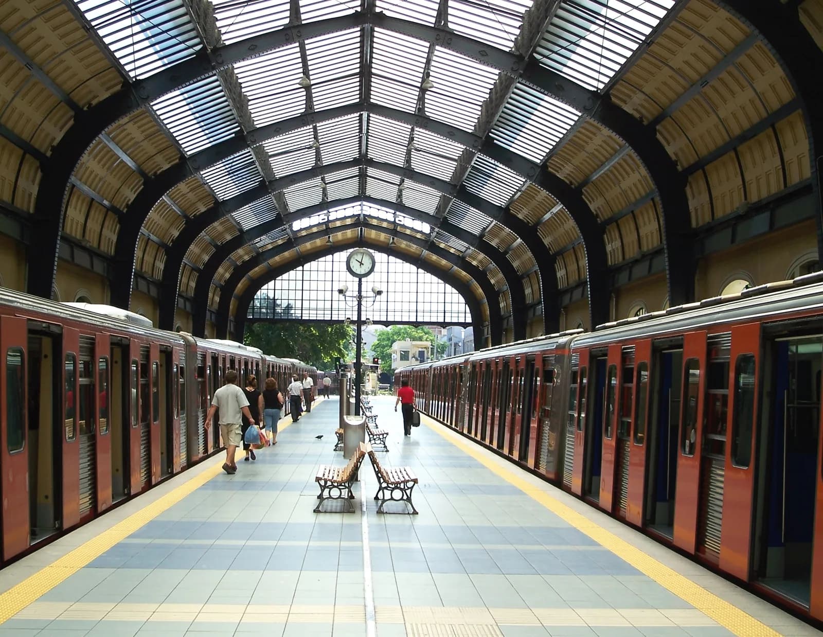 The arched train shed at Piraeus station, where metro lines 1 and 3 reach the port
