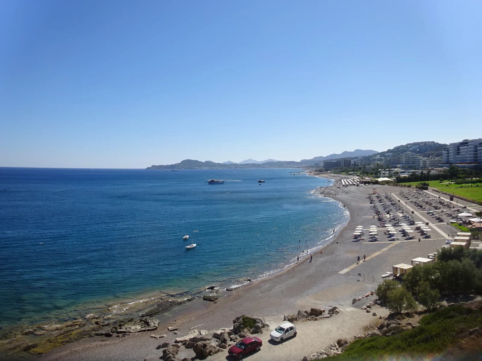 The long beach around Kallithea Bay at Faliraki, curving between Cape Vodi and Cape Ladiko