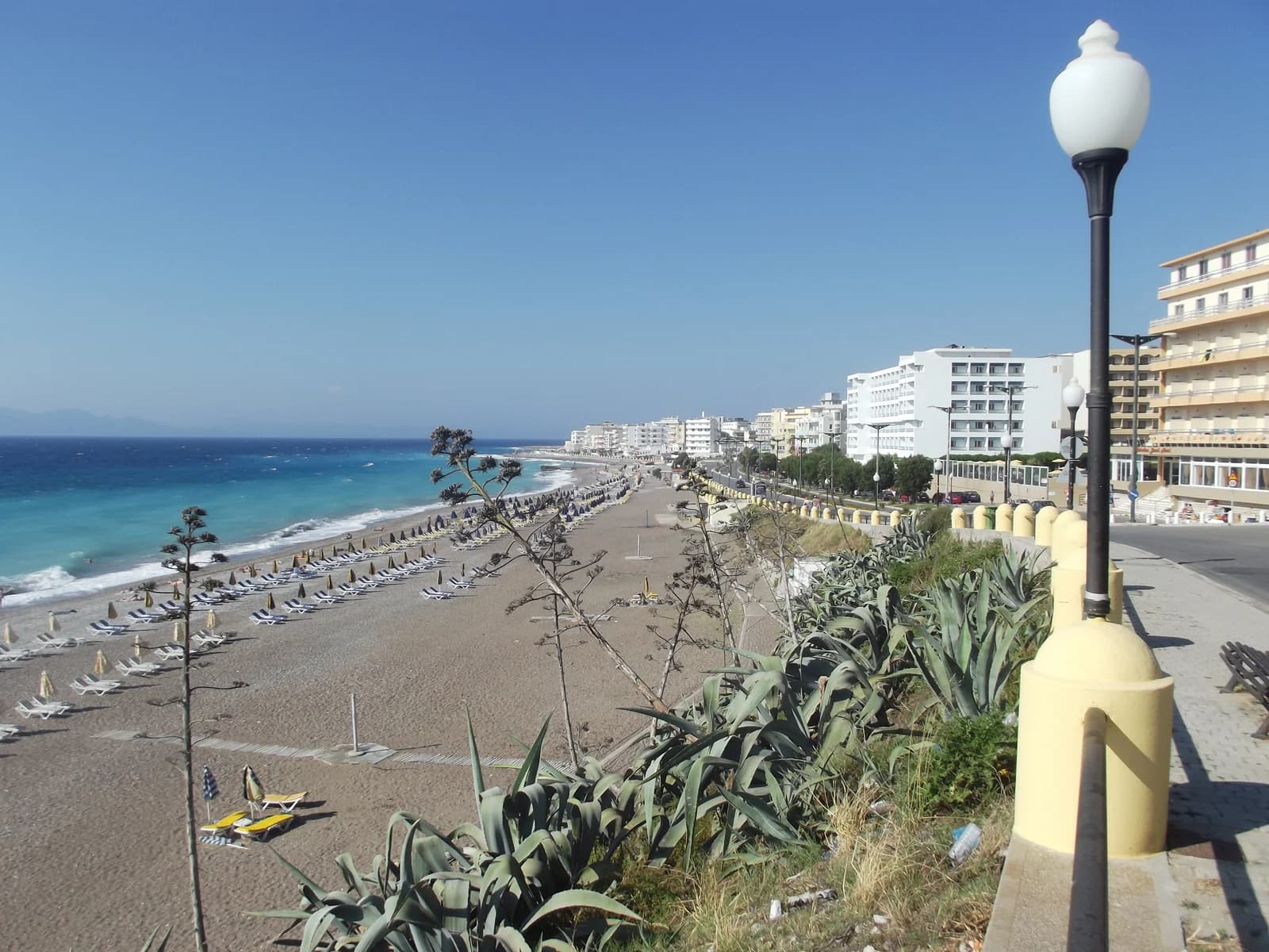 The town beach and seafront promenade in Rhodes New Town, lined with hotels