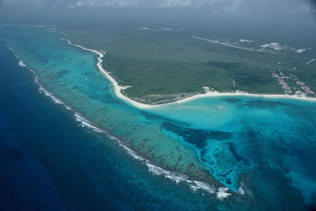 The reef line and white beach of the Maroma coast from the air, between Puerto Morelos and Playa del Carmen