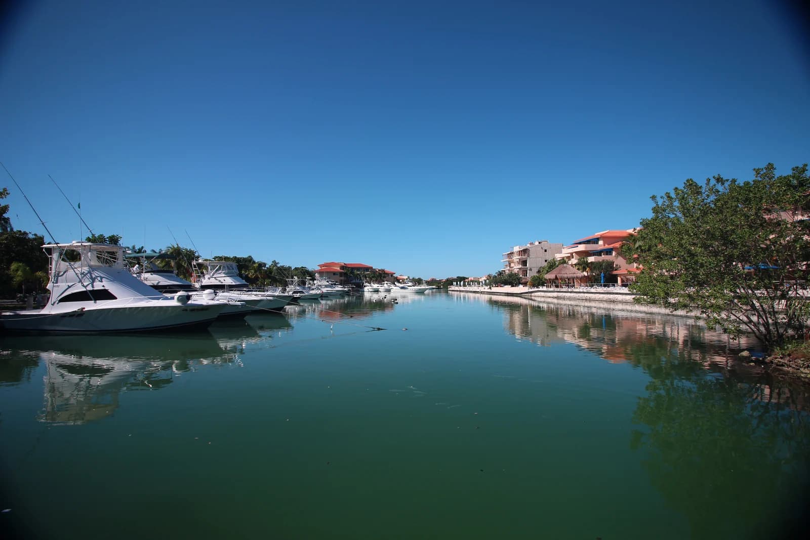 Yachts moored along the marina canal at Puerto Aventuras on the Riviera Maya