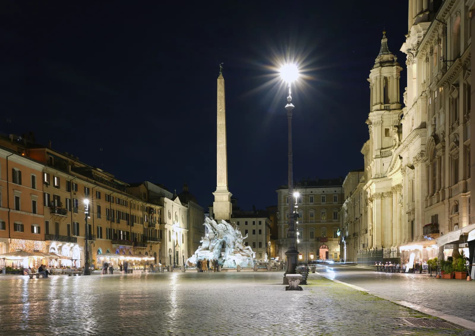 Piazza Navona in central Rome at night, the evening you trade away by sleeping at the cruise port instead