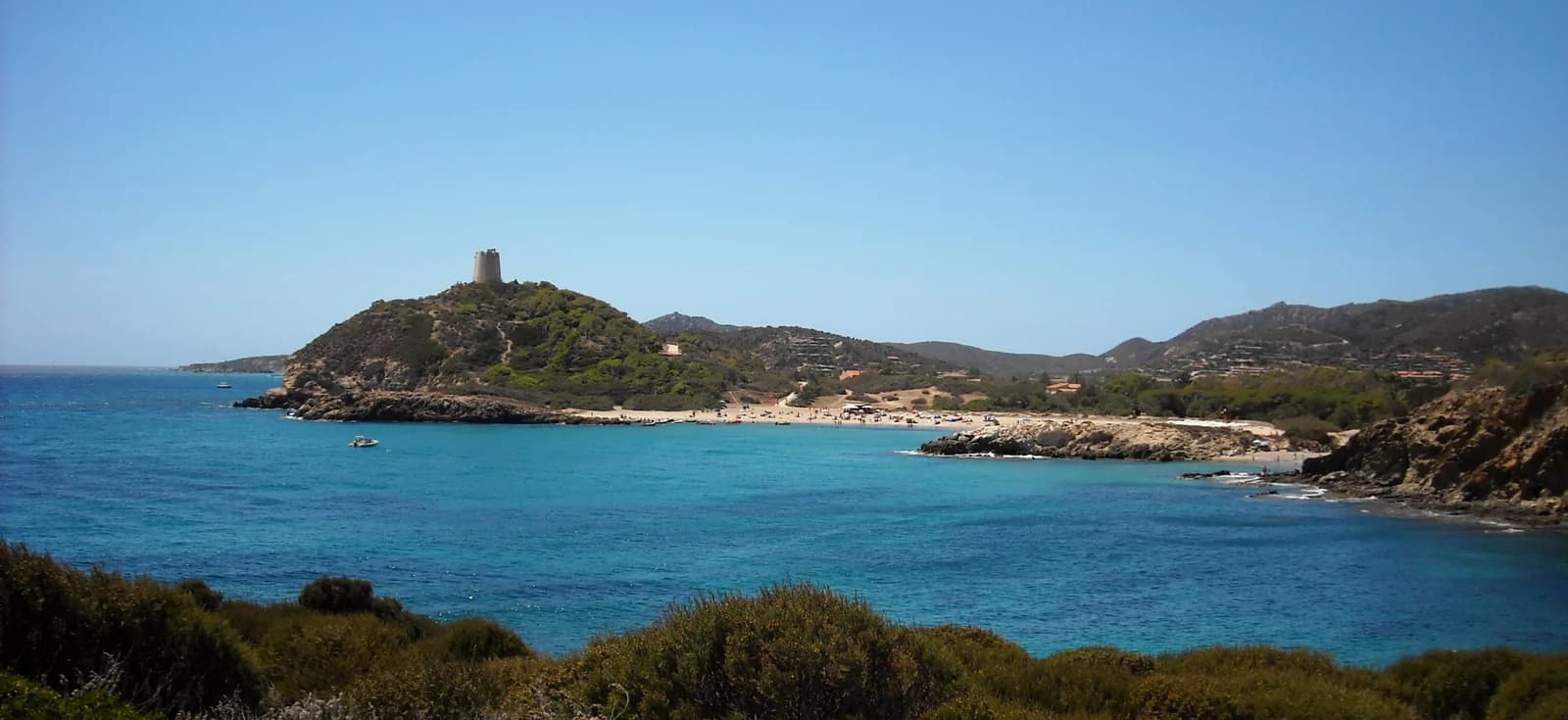 The watchtower on its headland above the bay at Chia, on Sardinia's south coast