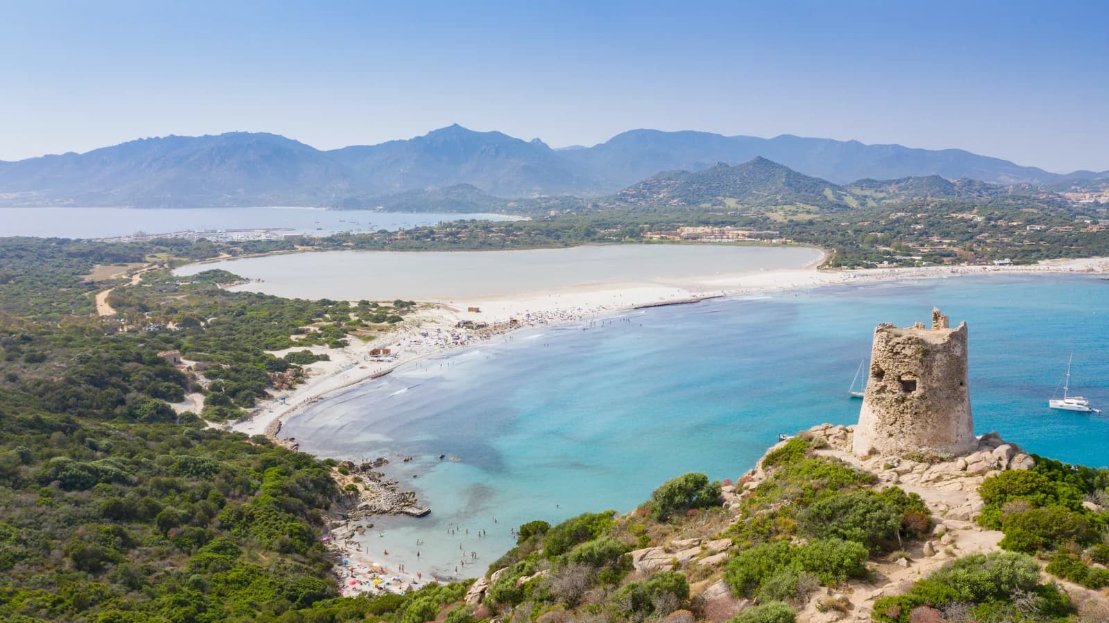Porto Giunco beach at Villasimius from the air, with its watchtower and the Notteri lagoon behind the sand