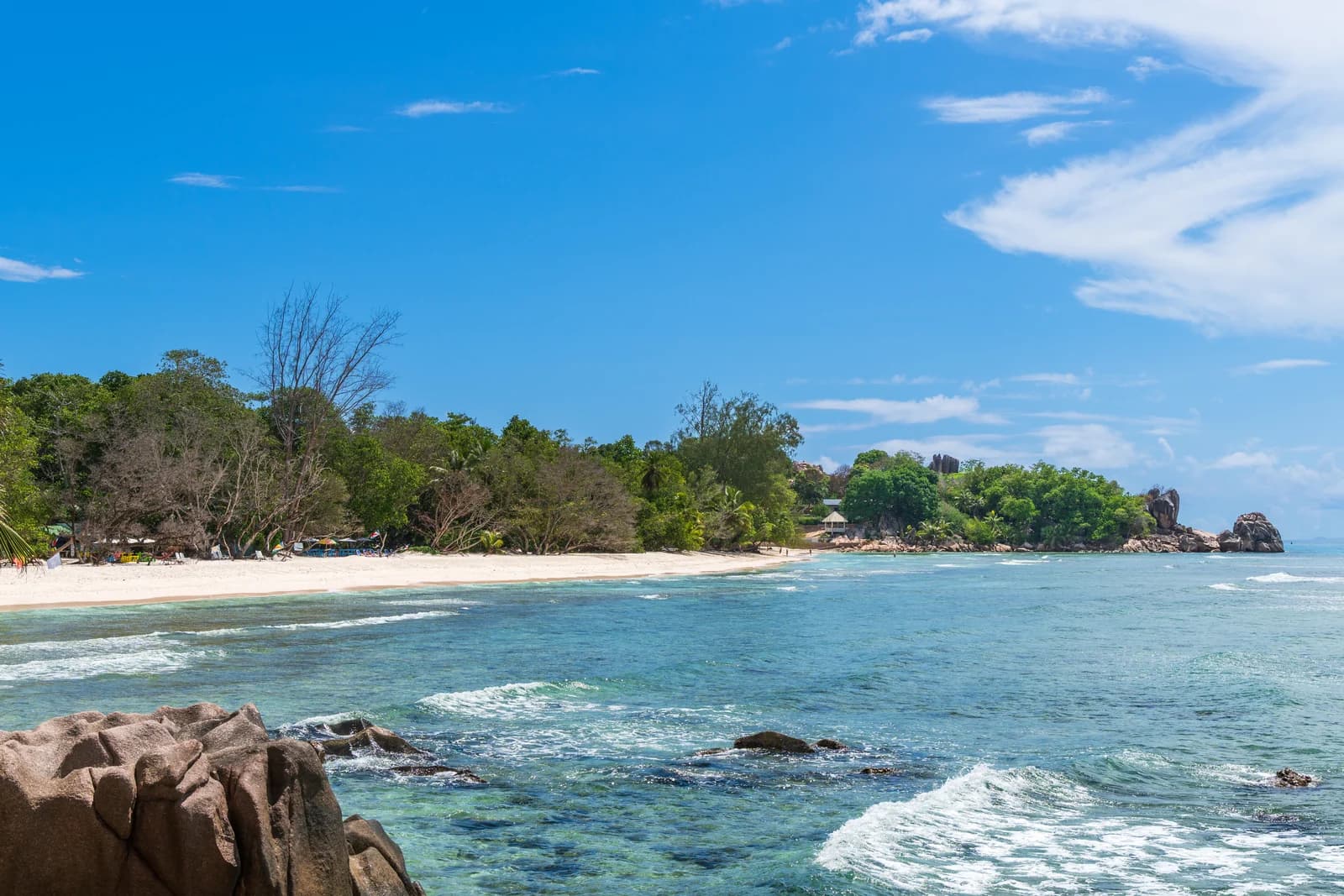Anse Sévère on La Digue, with granite rocks in the clear shallows, near the island's boutique hotels