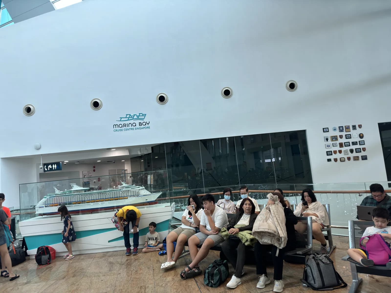 The departure hall at Marina Bay Cruise Centre in Singapore, with passengers waiting to board