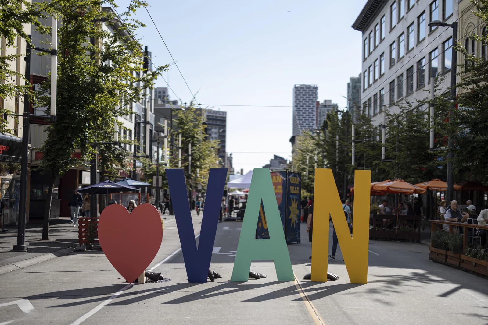 Granville Street in downtown Vancouver, with patio umbrellas set out on the pedestrian block