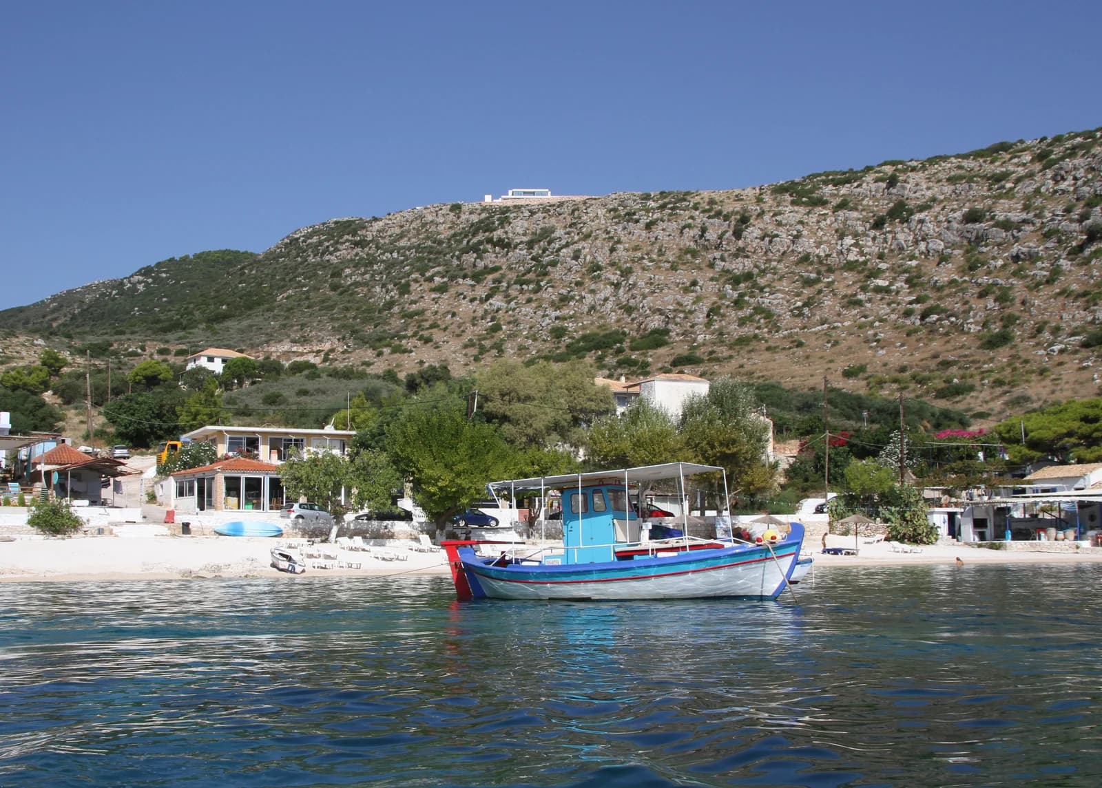 A fishing boat off the small beach at Agios Nikolaos in the north of Zante, the port village near the Blue Caves