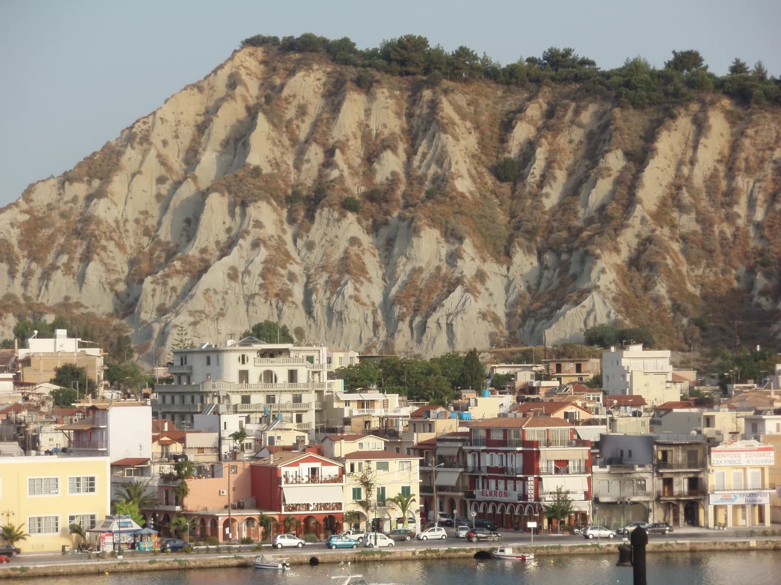 Houses on the Strada Marina waterfront of Zakynthos Town, with Bochali hill rising behind