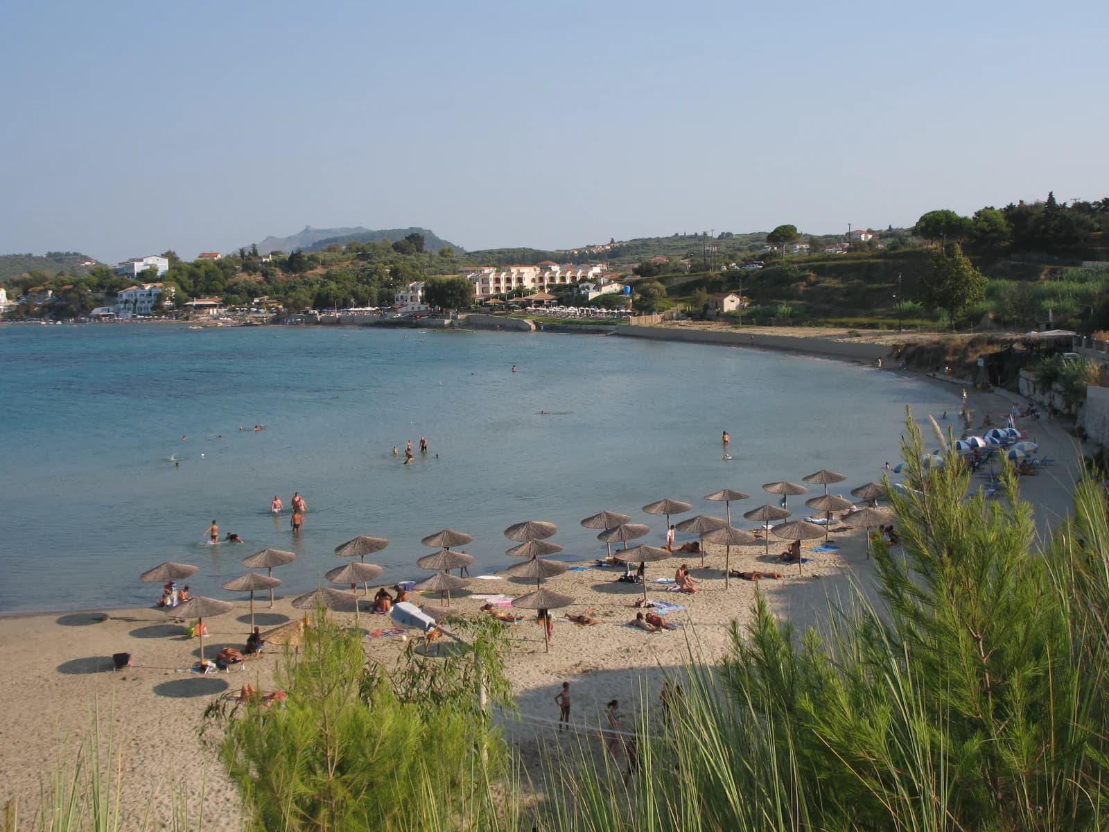 A sandy cove with sunshades on the Tragaki and Planos coast of north-east Zante