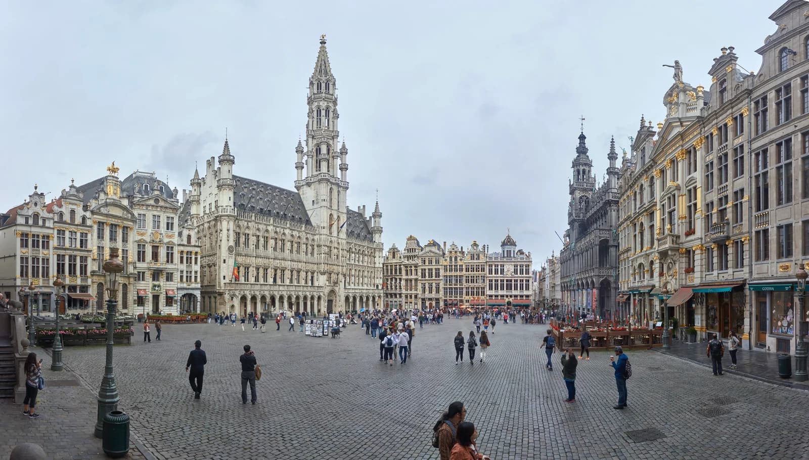 The Grand Place in Brussels, gilded guild houses and the town hall spire enclosing the cobbled square