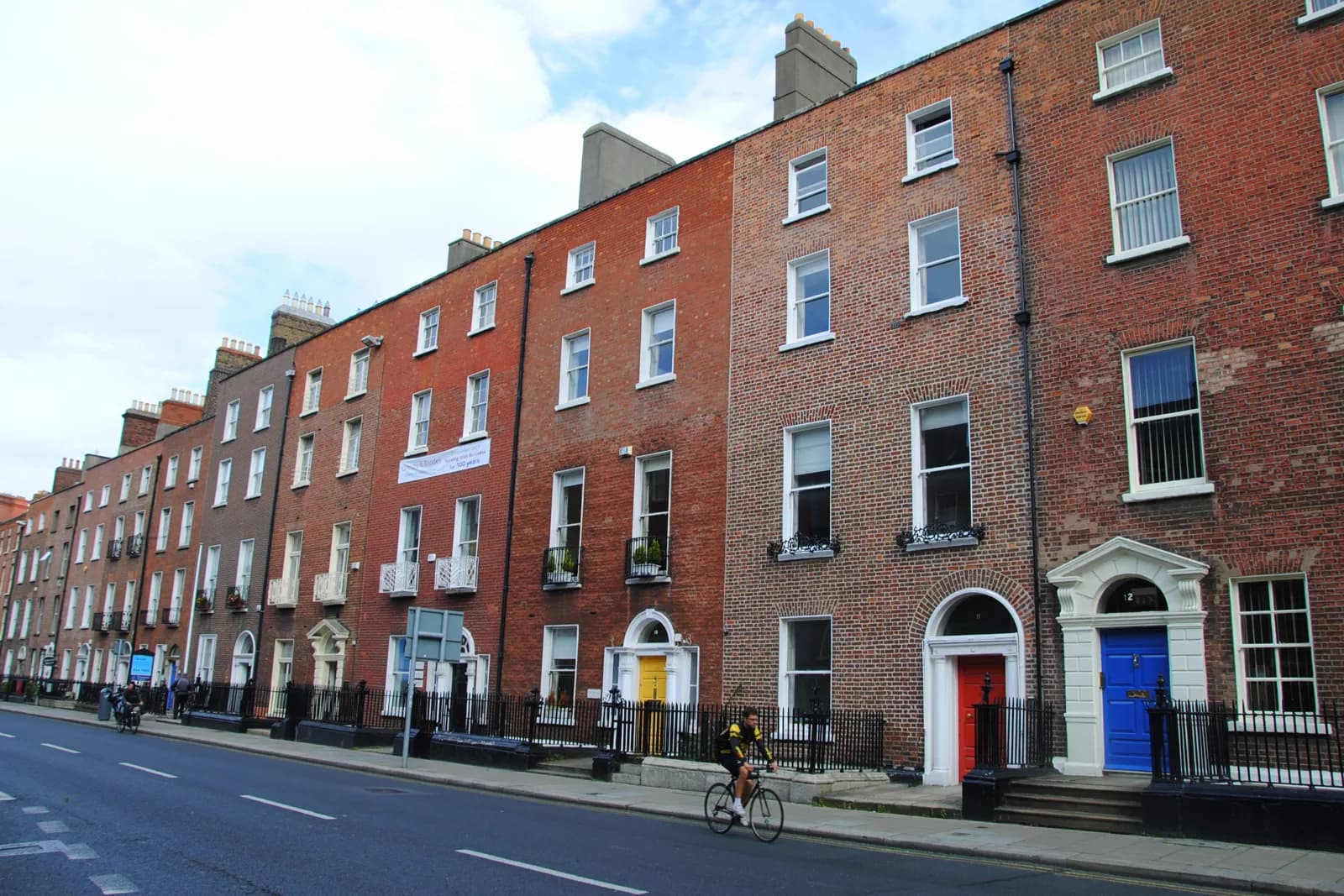 Georgian doors on a red-brick Dublin terrace, the streetscape around the best family hotels in Dublin