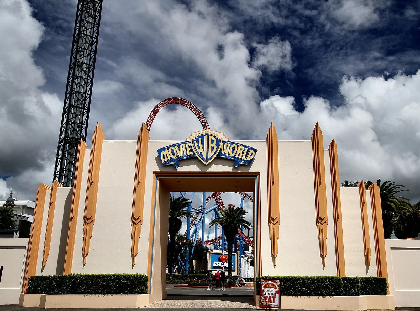 The ornamental entrance gates of a theme park in the northern Gold Coast under a clear sky