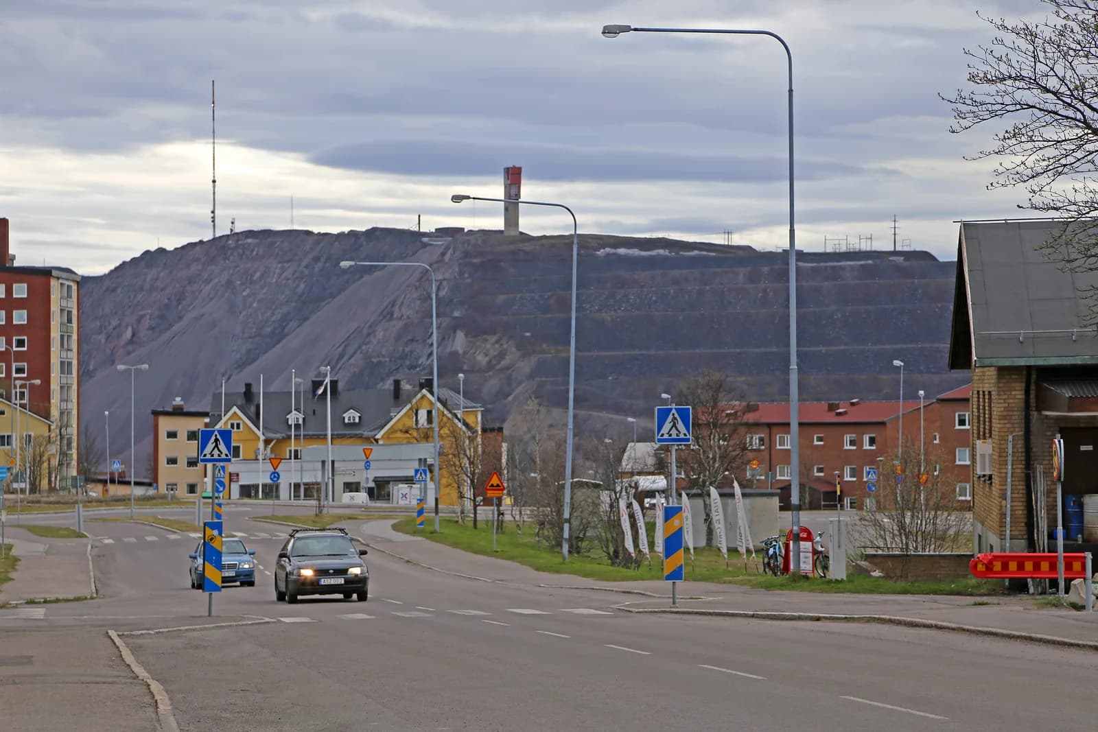 The town of Kiruna in Norrbotten spread across a low rise, the iron ore mine workings on the skyline behind it