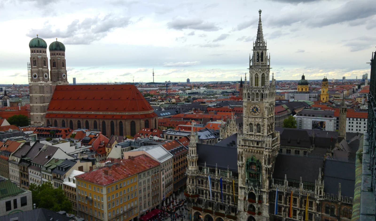 Munich's new town hall on Marienplatz with the twin domed towers of the Frauenkirche rising behind it