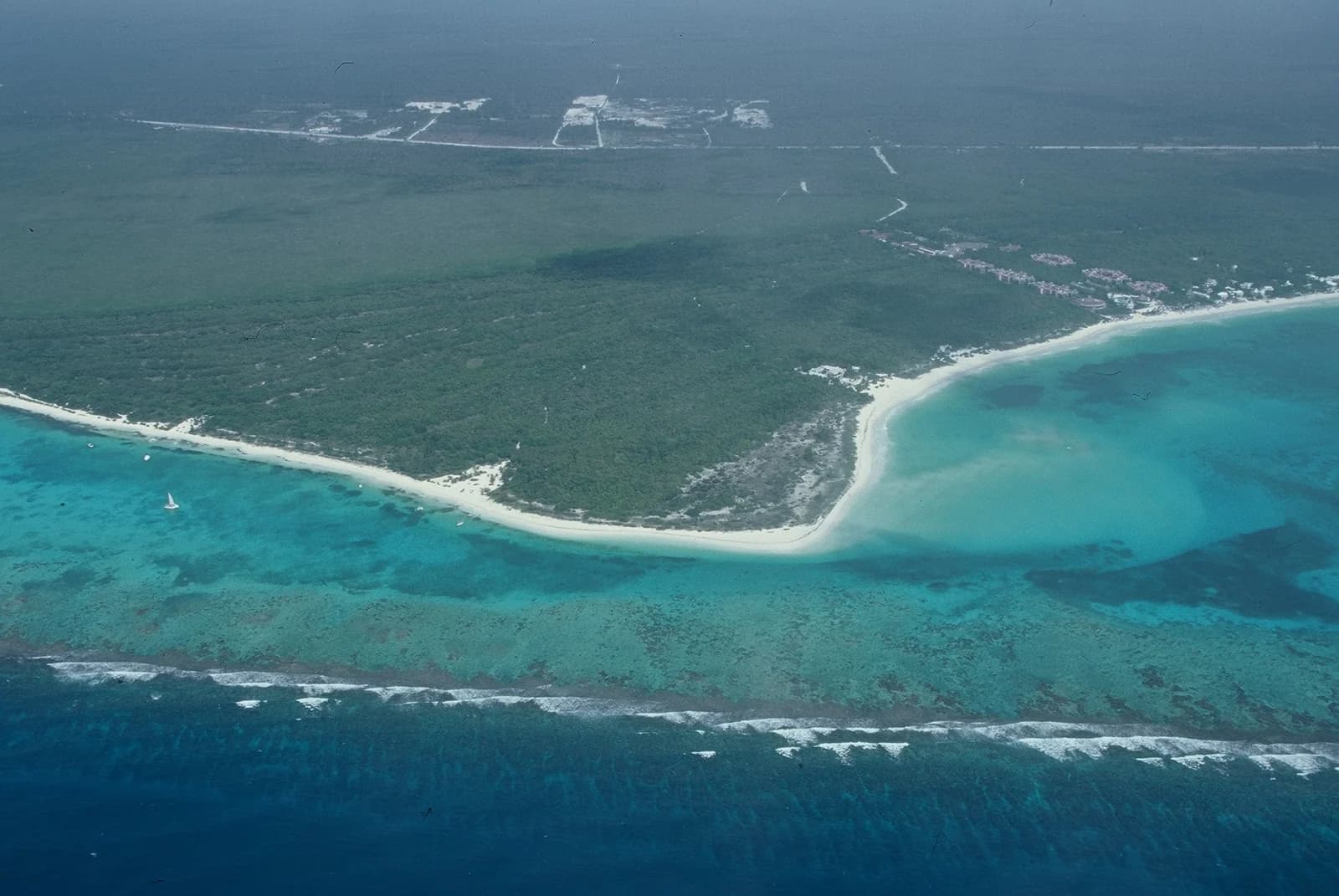 The reef, lagoon and white beach of Punta Maroma on the Riviera Maya coast, seen from the air