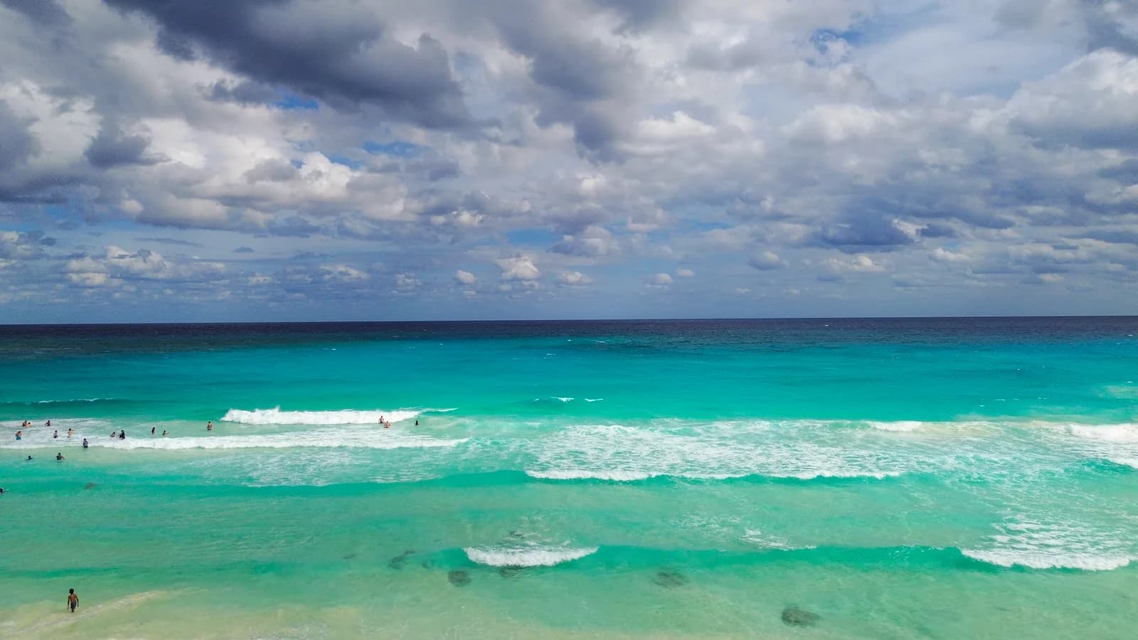 Turquoise Caribbean water and white sand at Playa Gaviota Azul, Cancún, Mexico