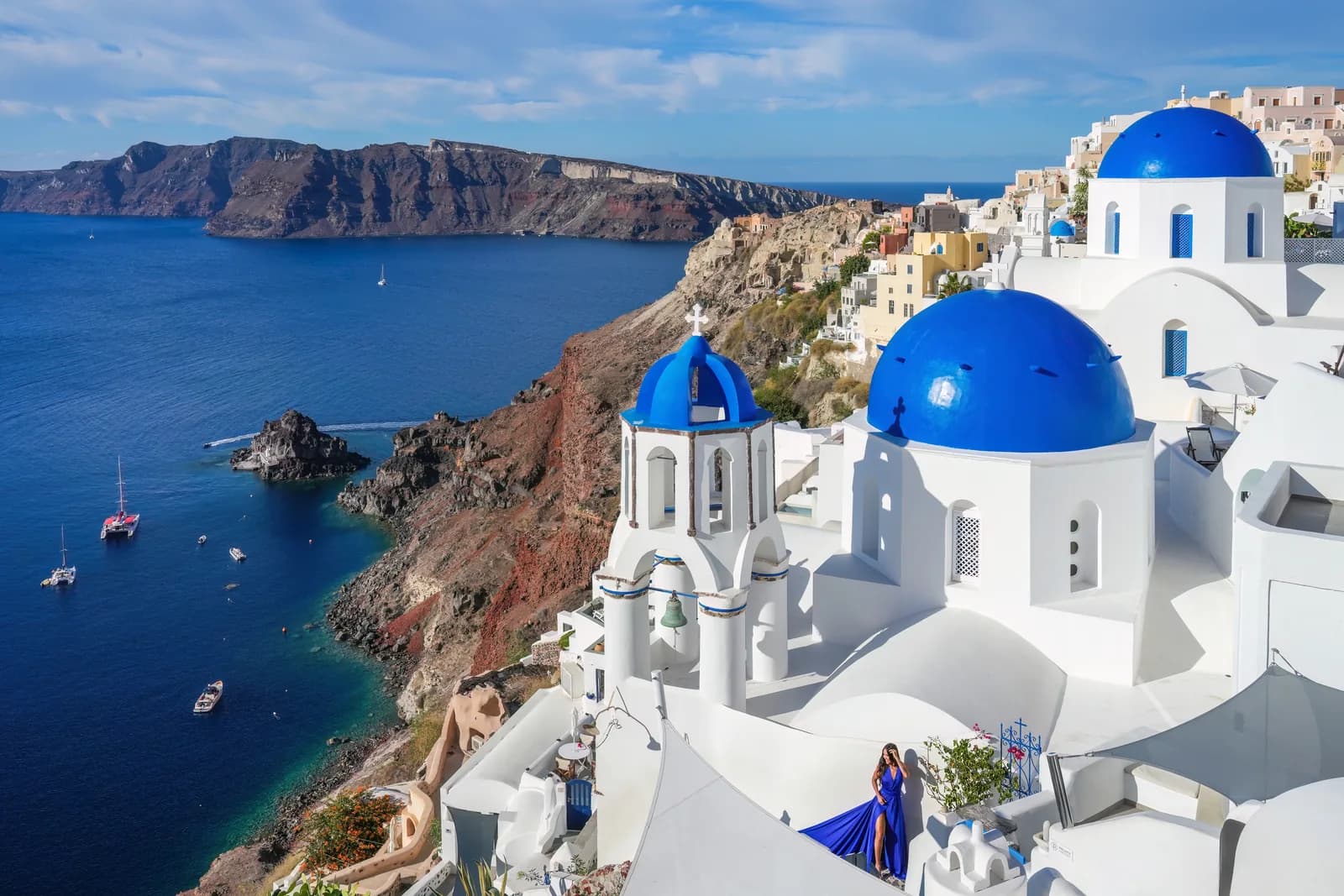 Blue-domed churches of Oia overlooking the caldera and Aegean Sea, Santorini, Greece
