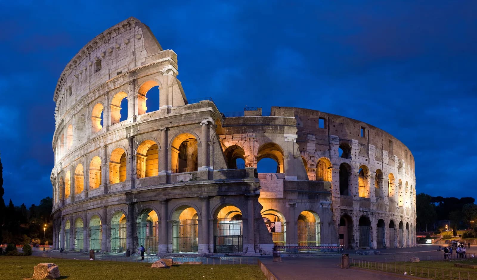 The Colosseum illuminated at dusk in Rome, Italy